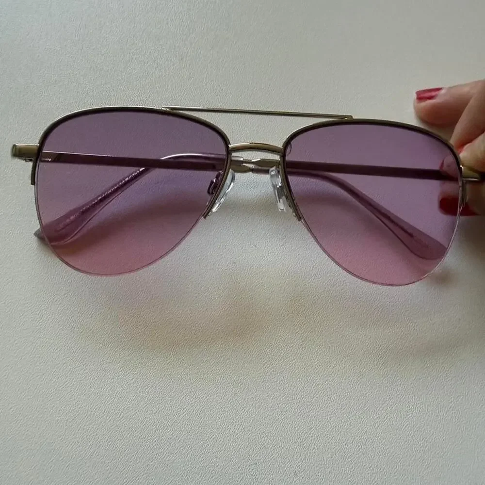 Gold aviator sunglasses with purple